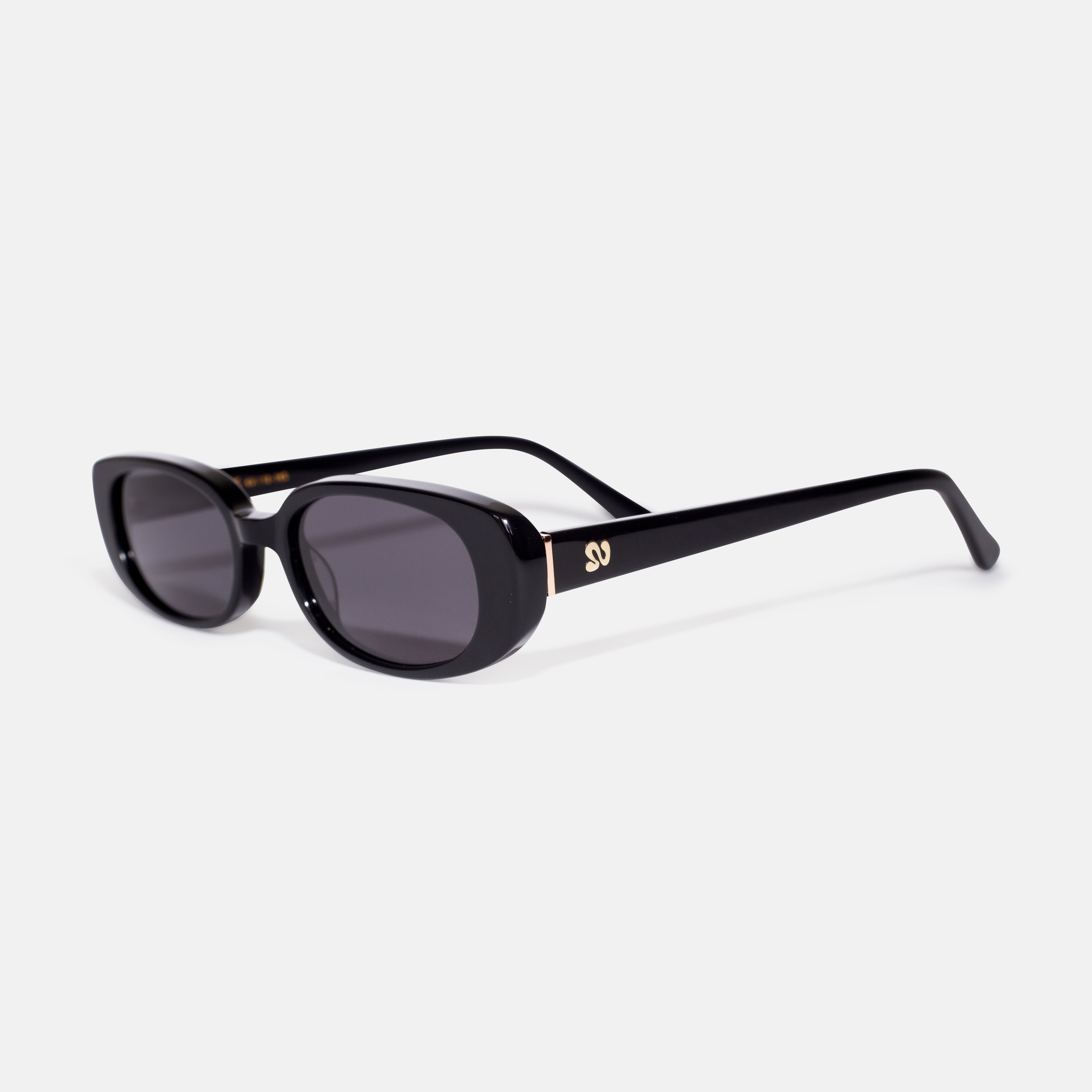 Side angle of black oval sunglasses showing temple detail, designed for smaller faces by Isla Sunwear.