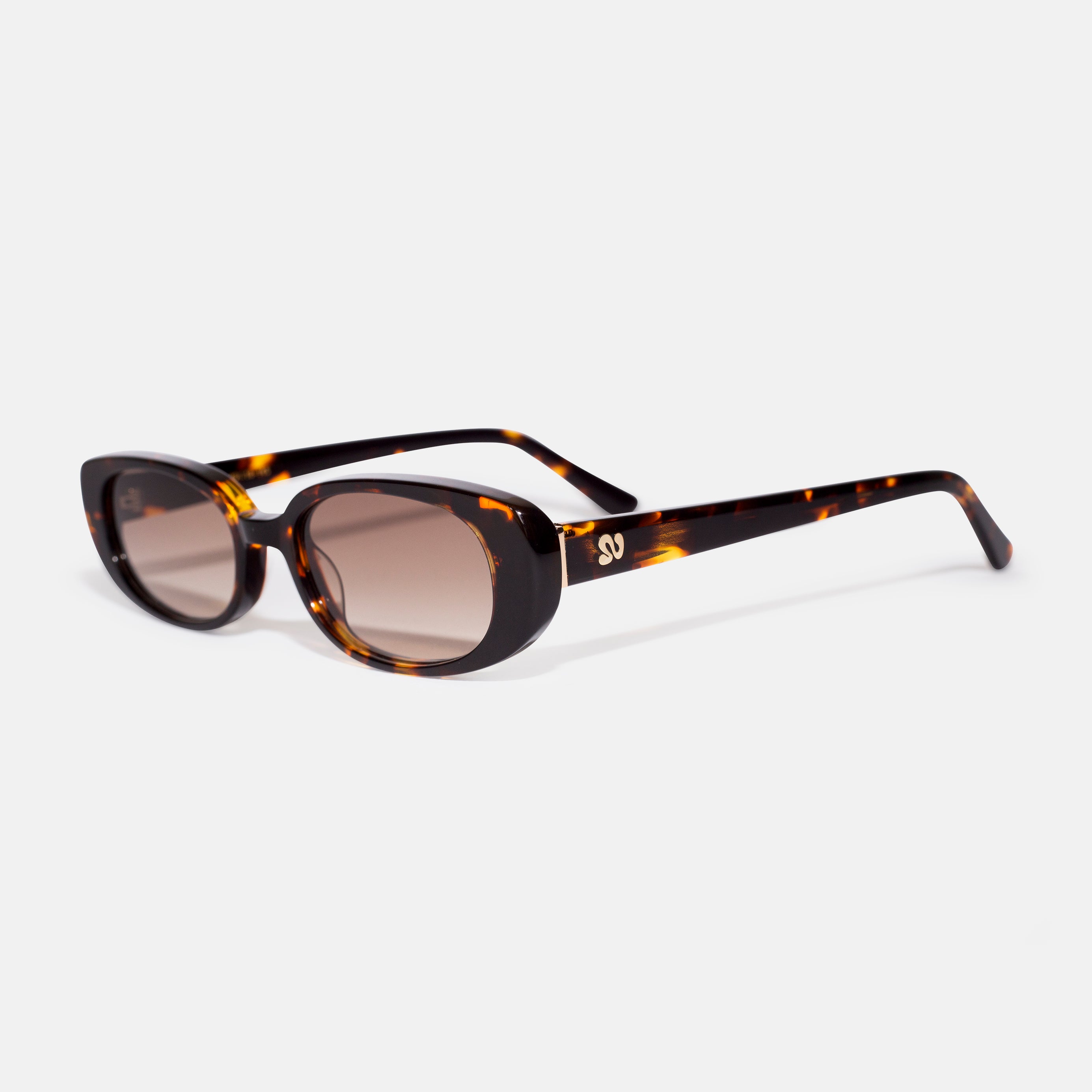 Side angle of tortoise oval sunglasses showing temple detail, designed for smaller faces by Isla Sunwear.