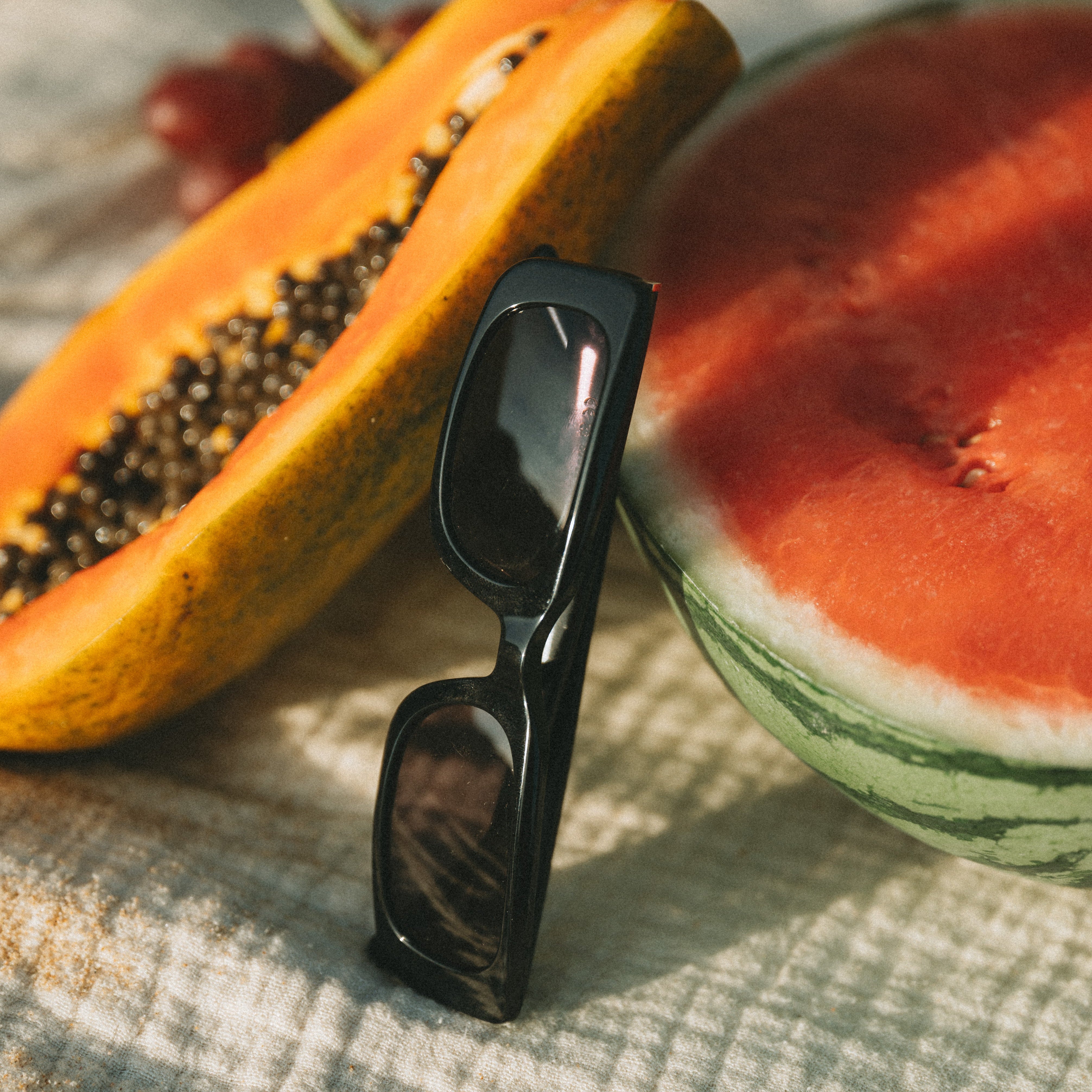 Closeup product shot of Isla Sunwear black rectangular sunglasses, designed for smaller faces.