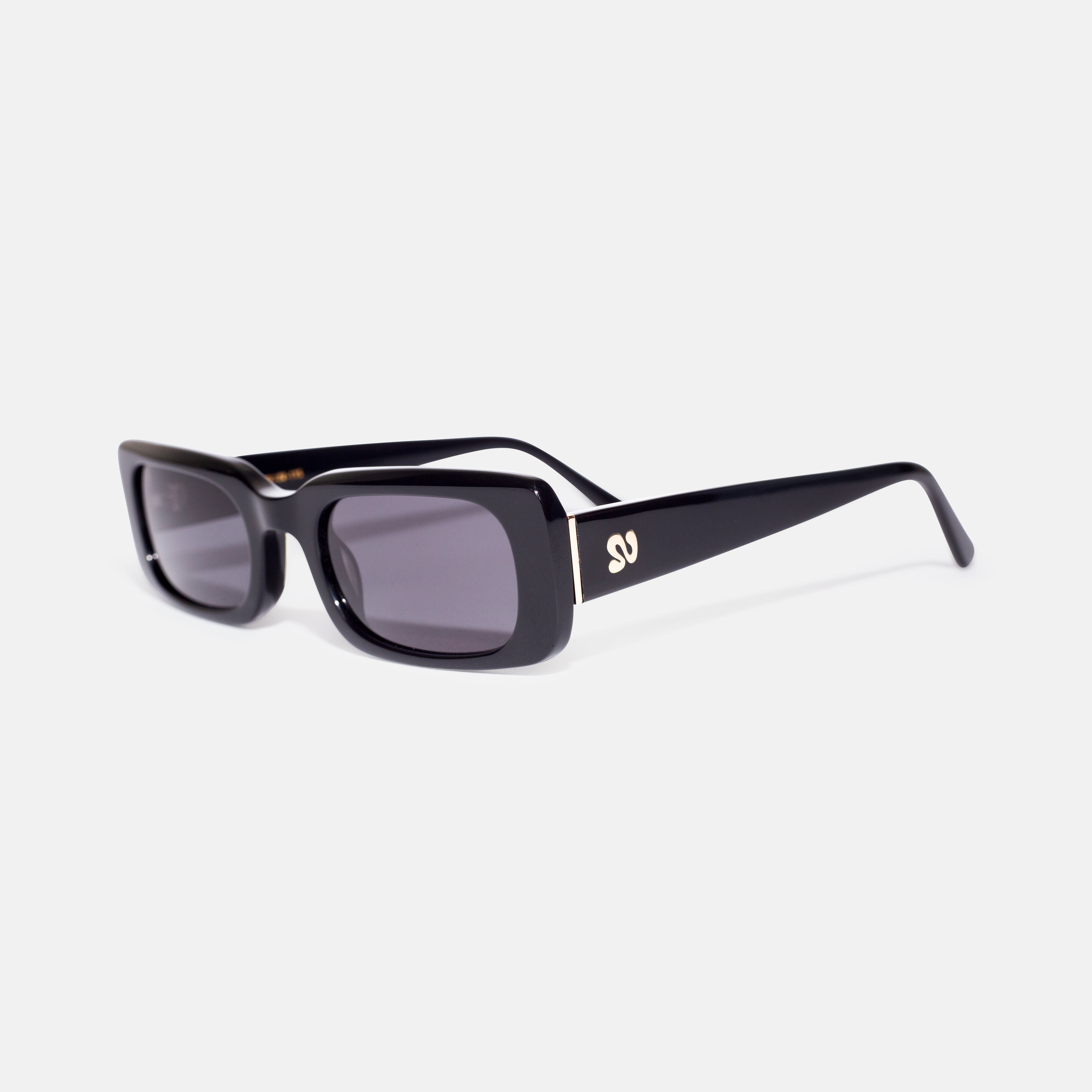 Side angle of black rectangular sunglasses showing temple detail, designed for smaller faces by Isla Sunwear.