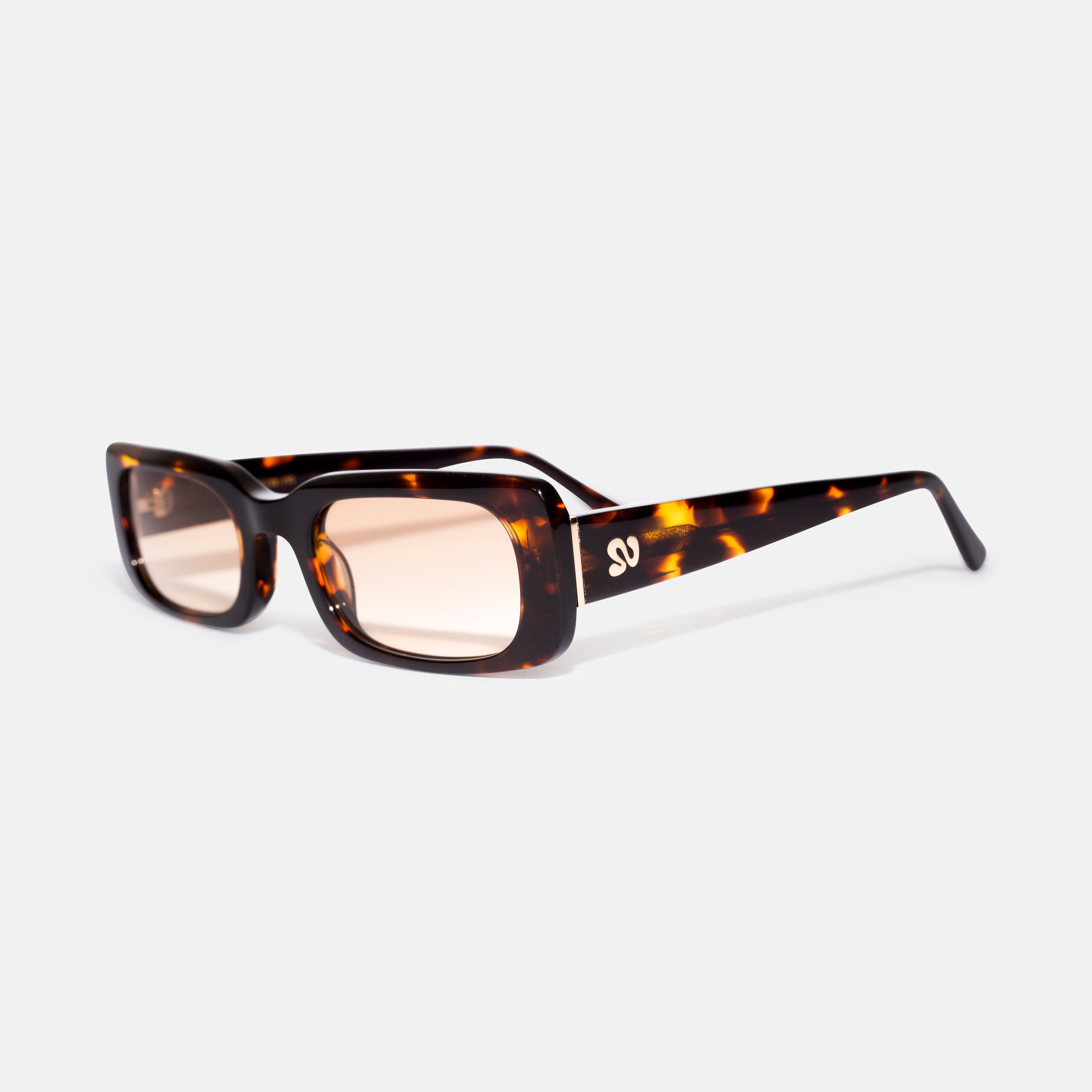 Side angle of tortoise rectangular sunglasses showing temple detail, designed for smaller faces by Isla Sunwear.