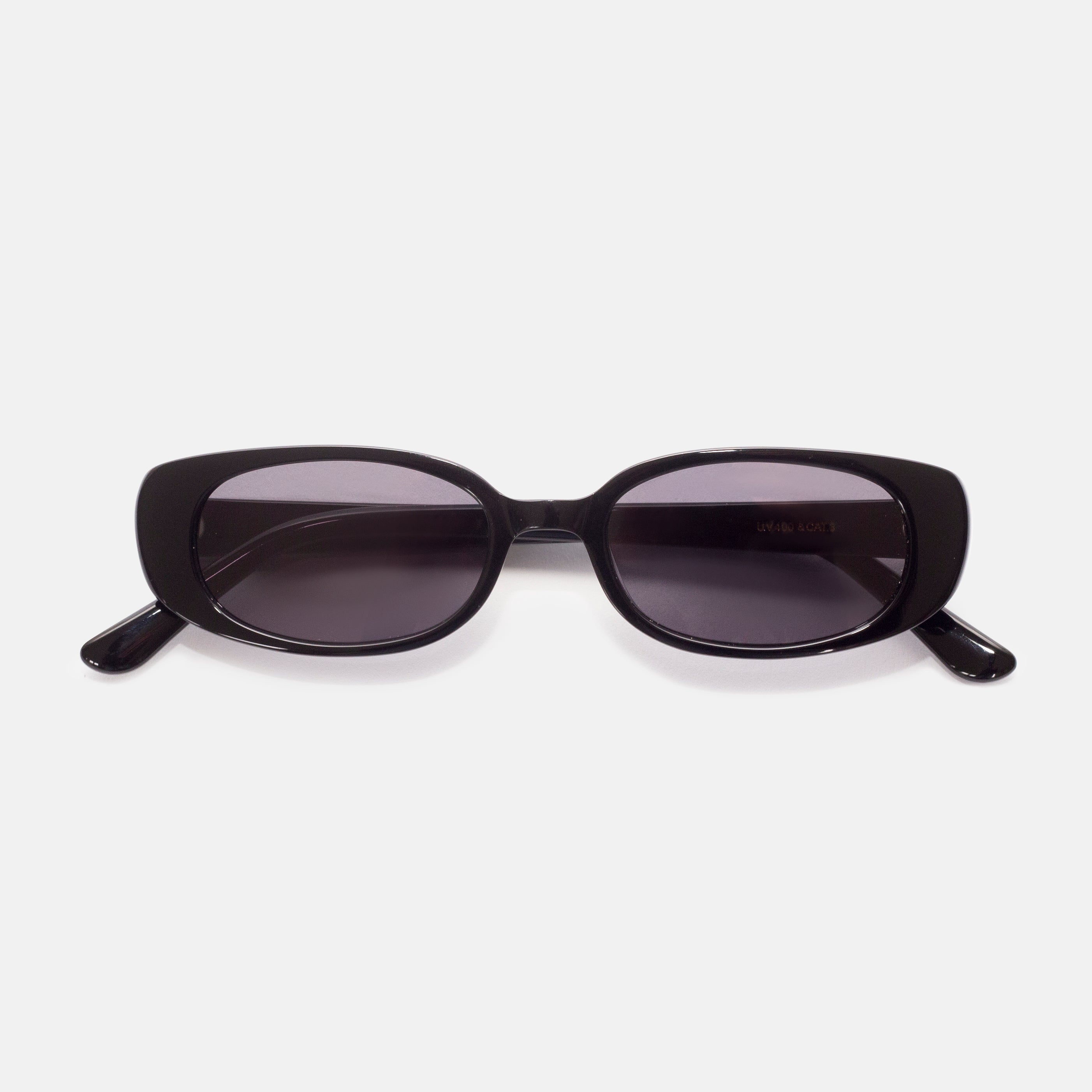 Front view of black oval sunglasses designed for smaller faces by Isla Sunwear.