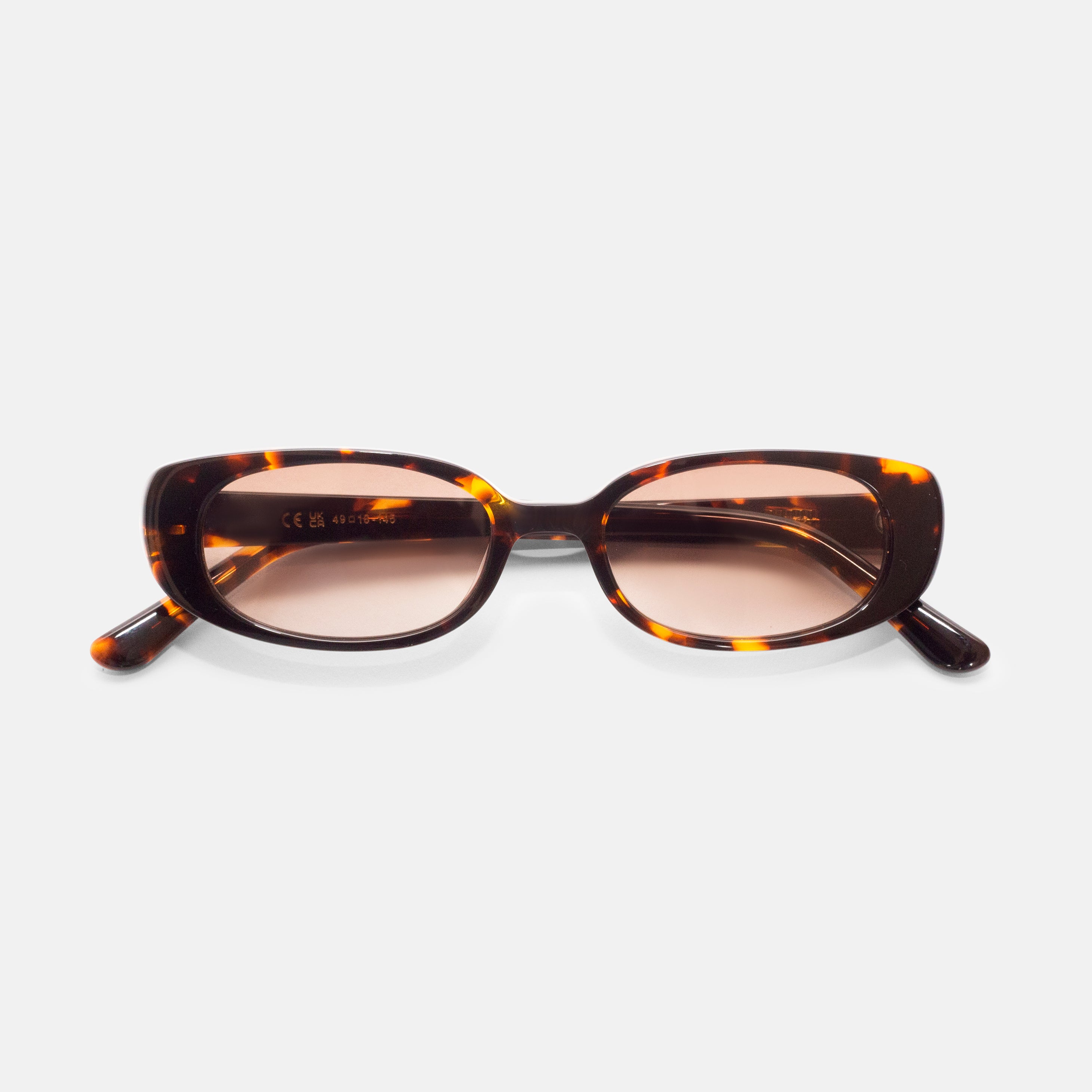 Front view of tortoise oval sunglasses designed for smaller faces by Isla Sunwear.