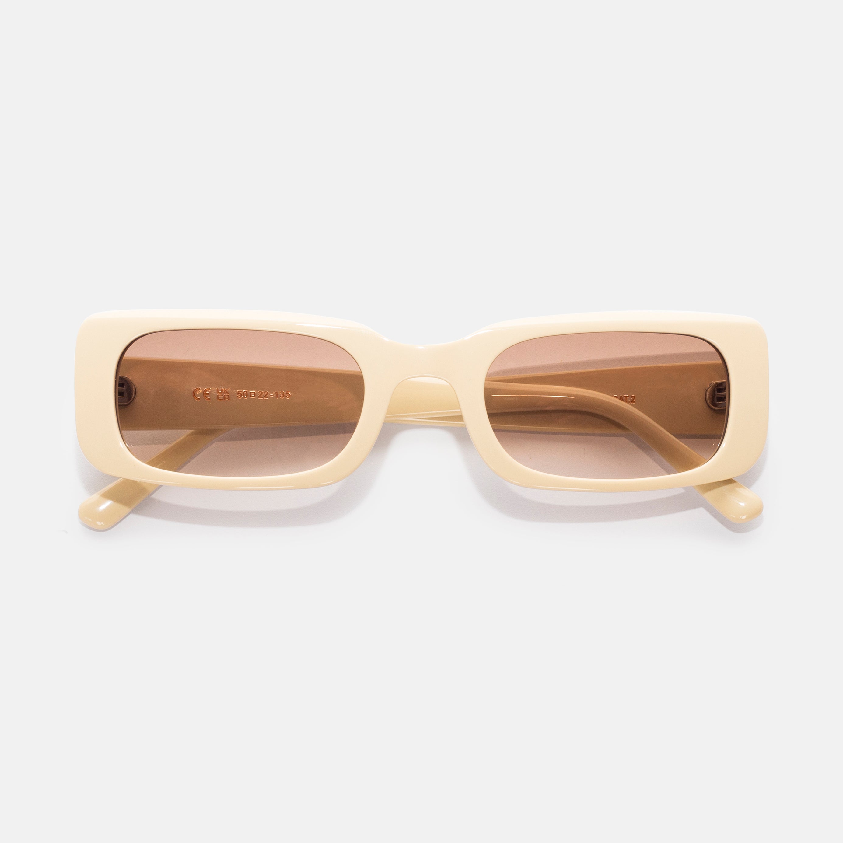 Front view of sand-colored rectangular sunglasses designed for smaller faces by Isla Sunwear.
